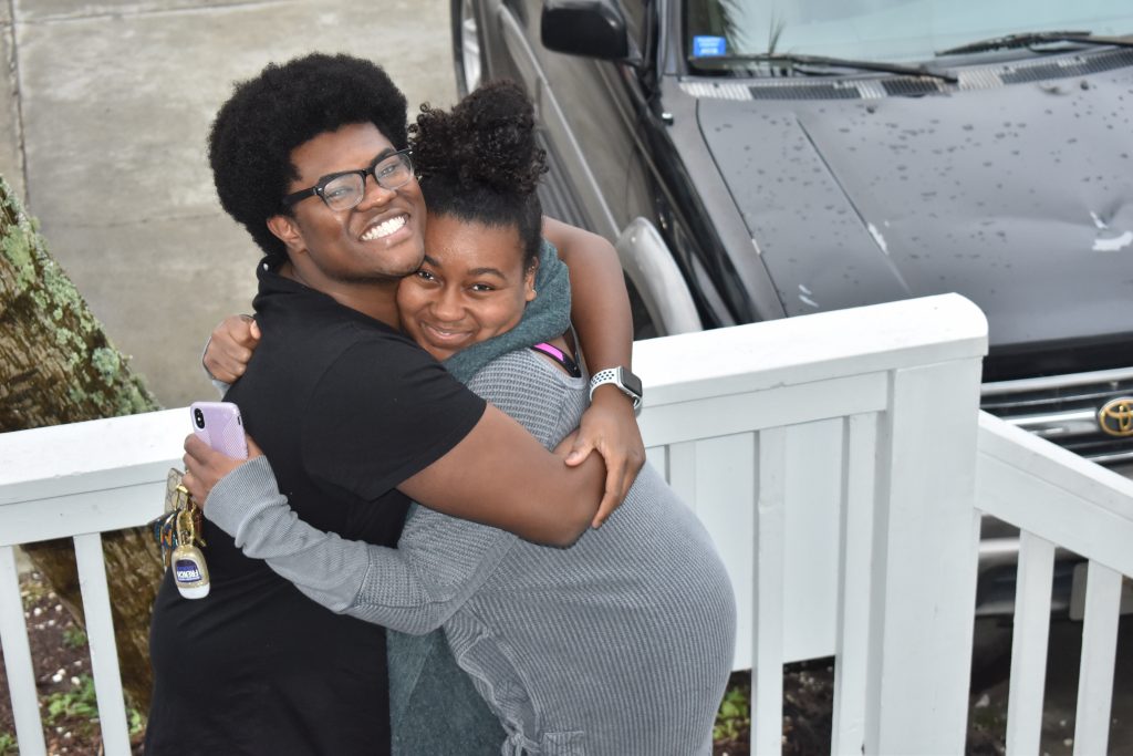 brown skin kids hugging at Myrtle Beach South Carolina during thanksgiving