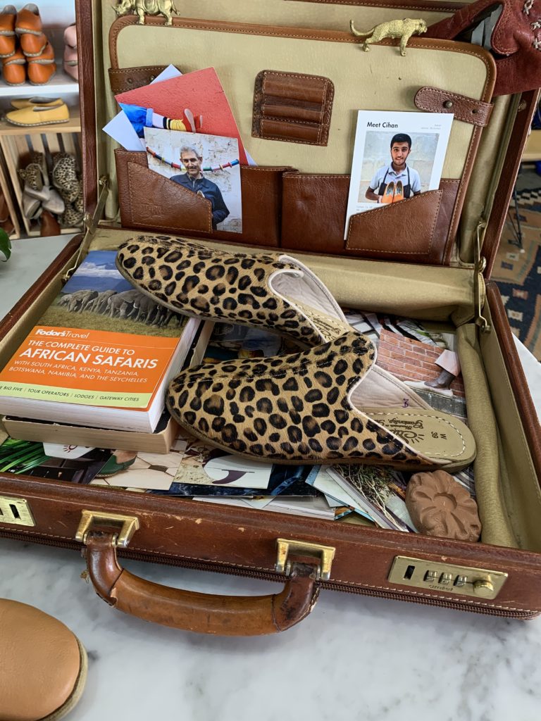 open suitcase with Sabah shoes from union market DC